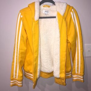 Yellow bomber jacket fuzzy on the inside